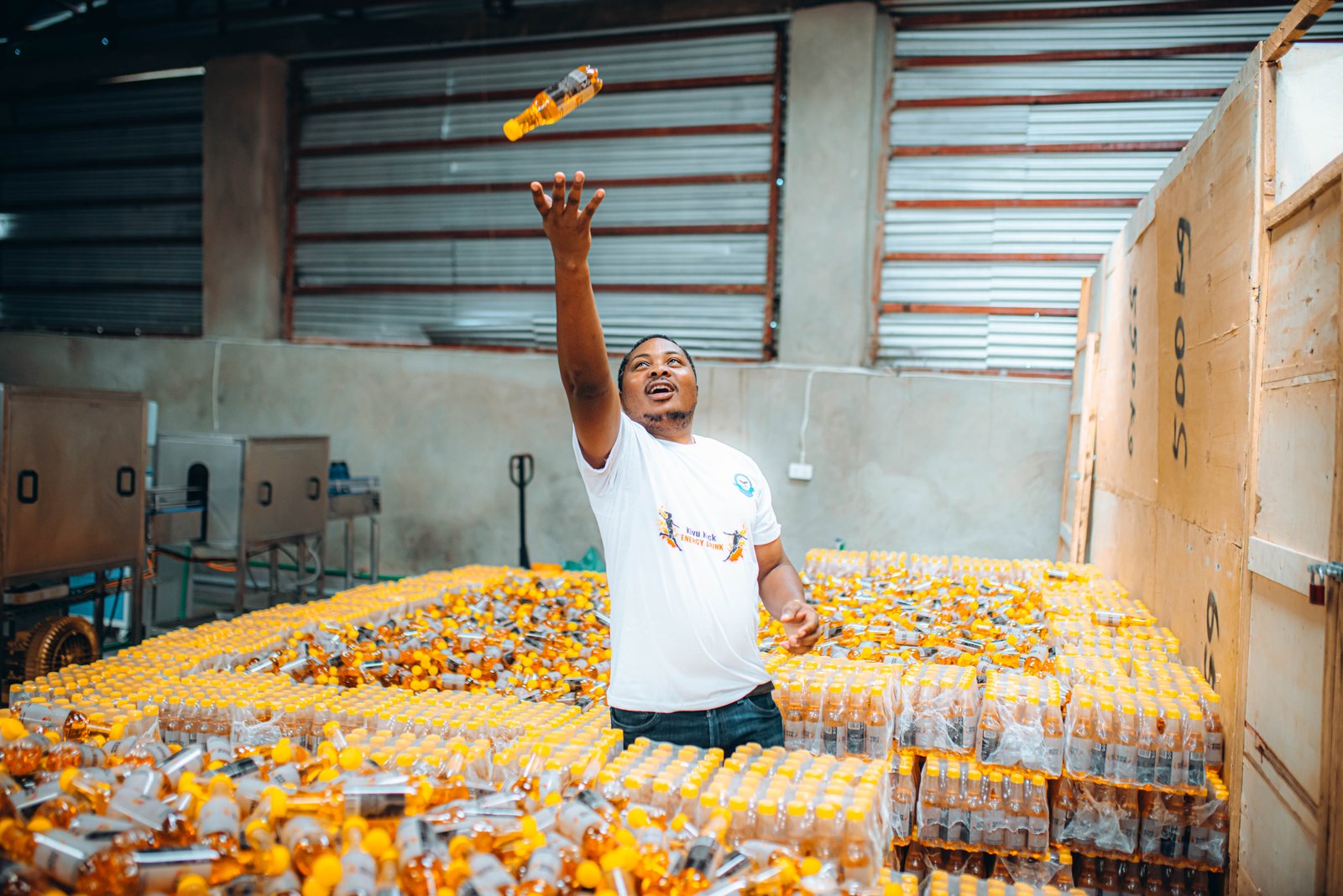 Kivu Kick bottle toss in the warehouse